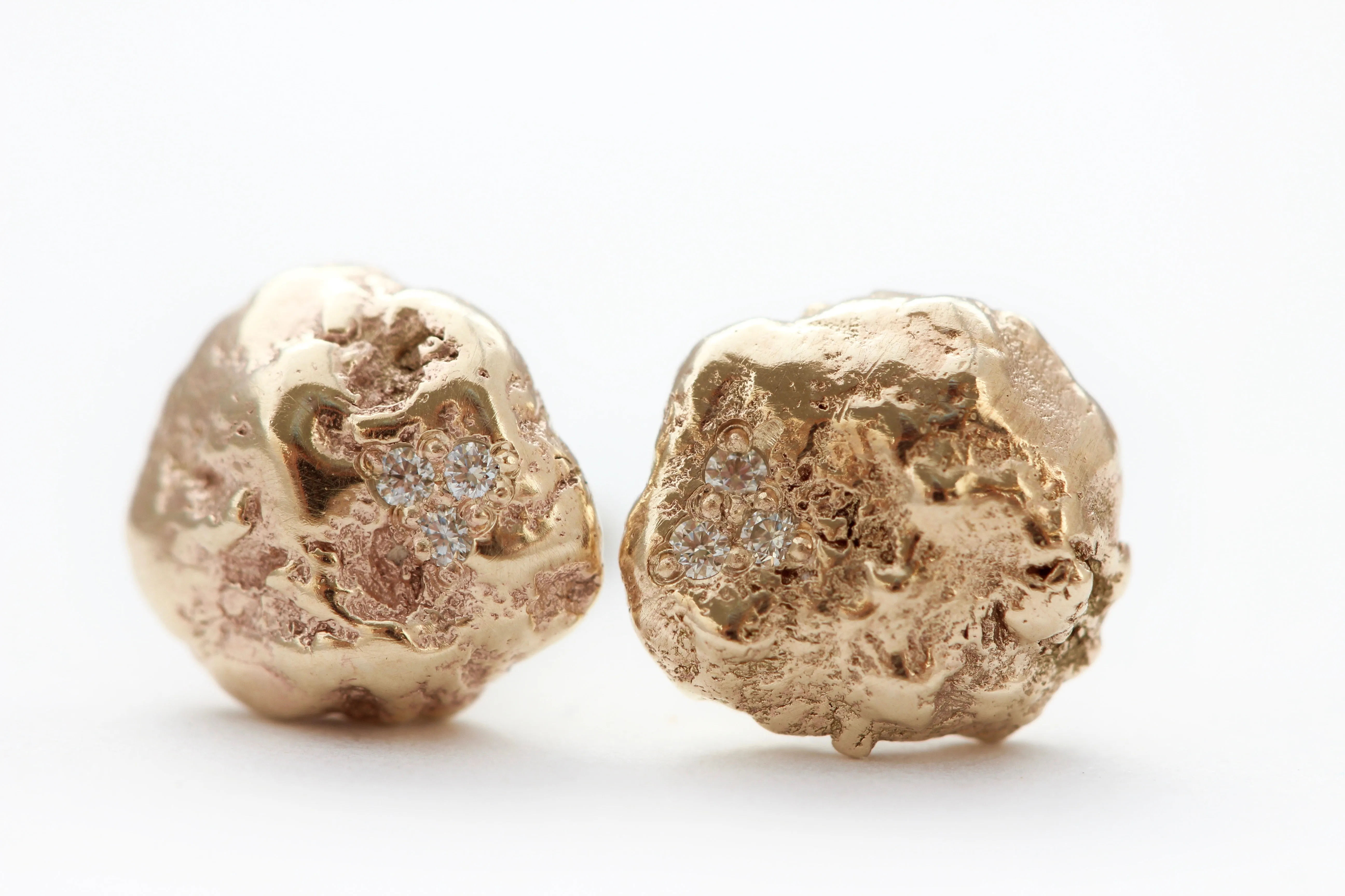 14k Yellow gold stud earrings with six white diamonds
