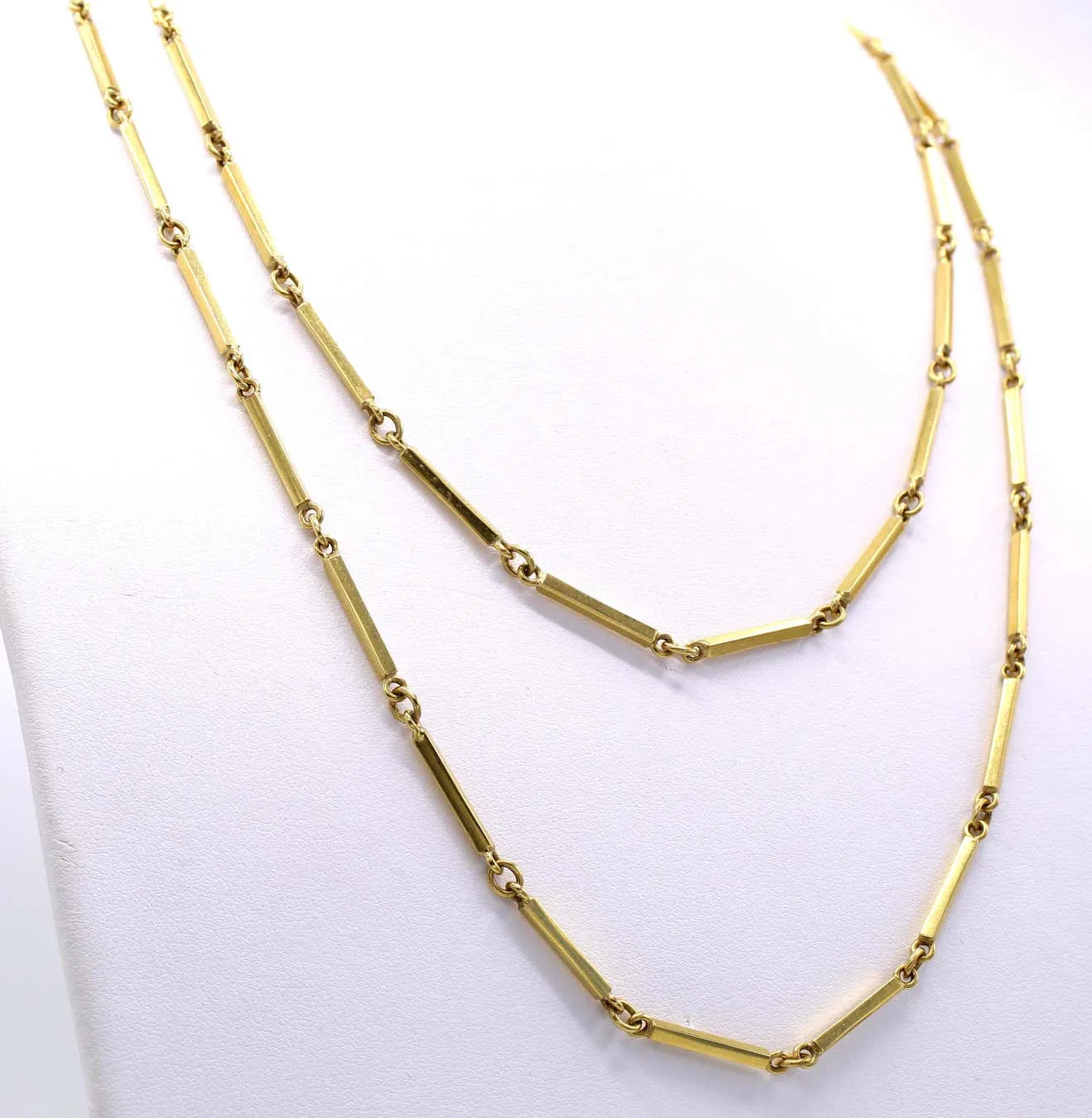 1980s 18 karat yellow gold long chain necklace.