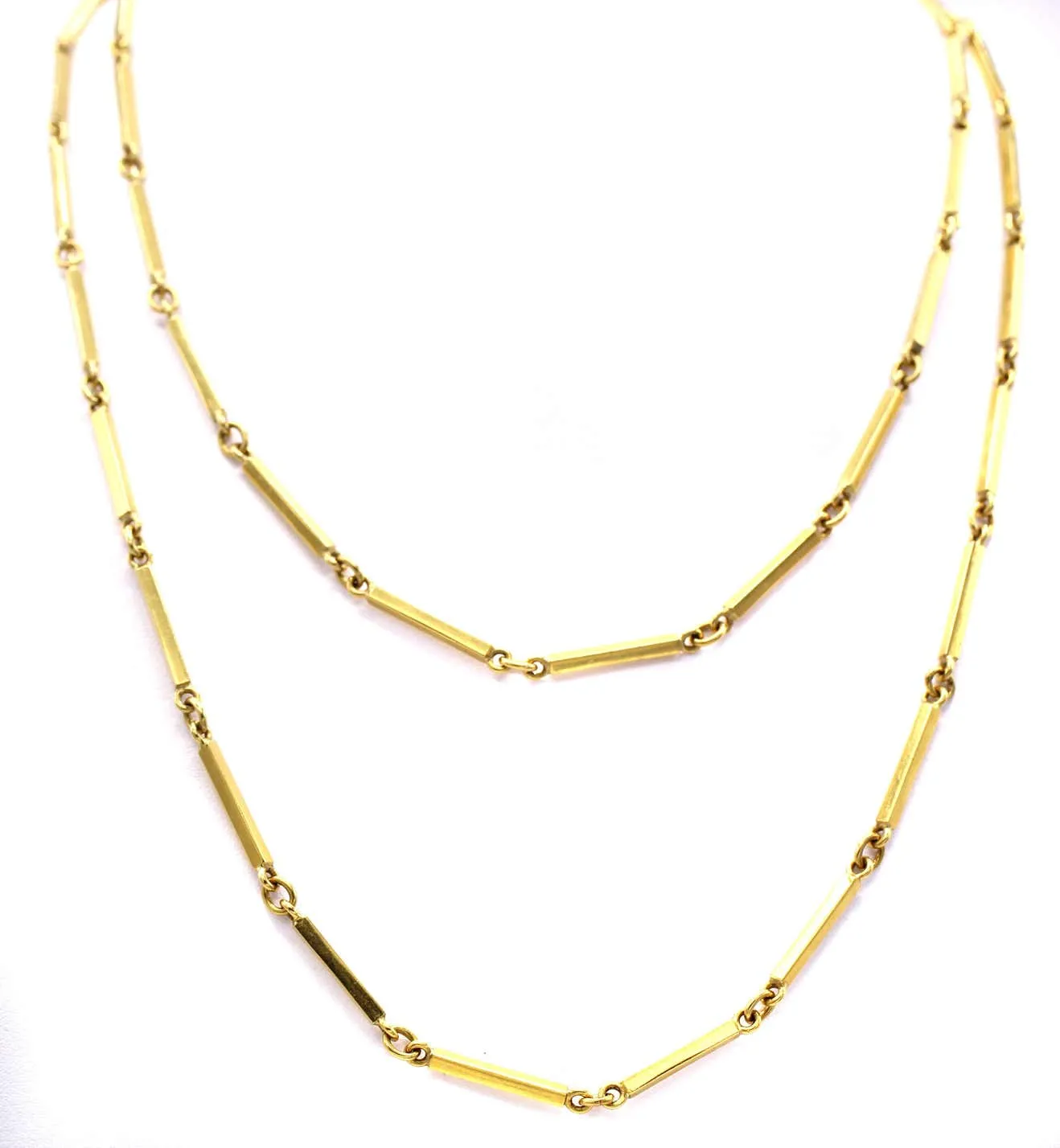 1980s 18 karat yellow gold long chain necklace.