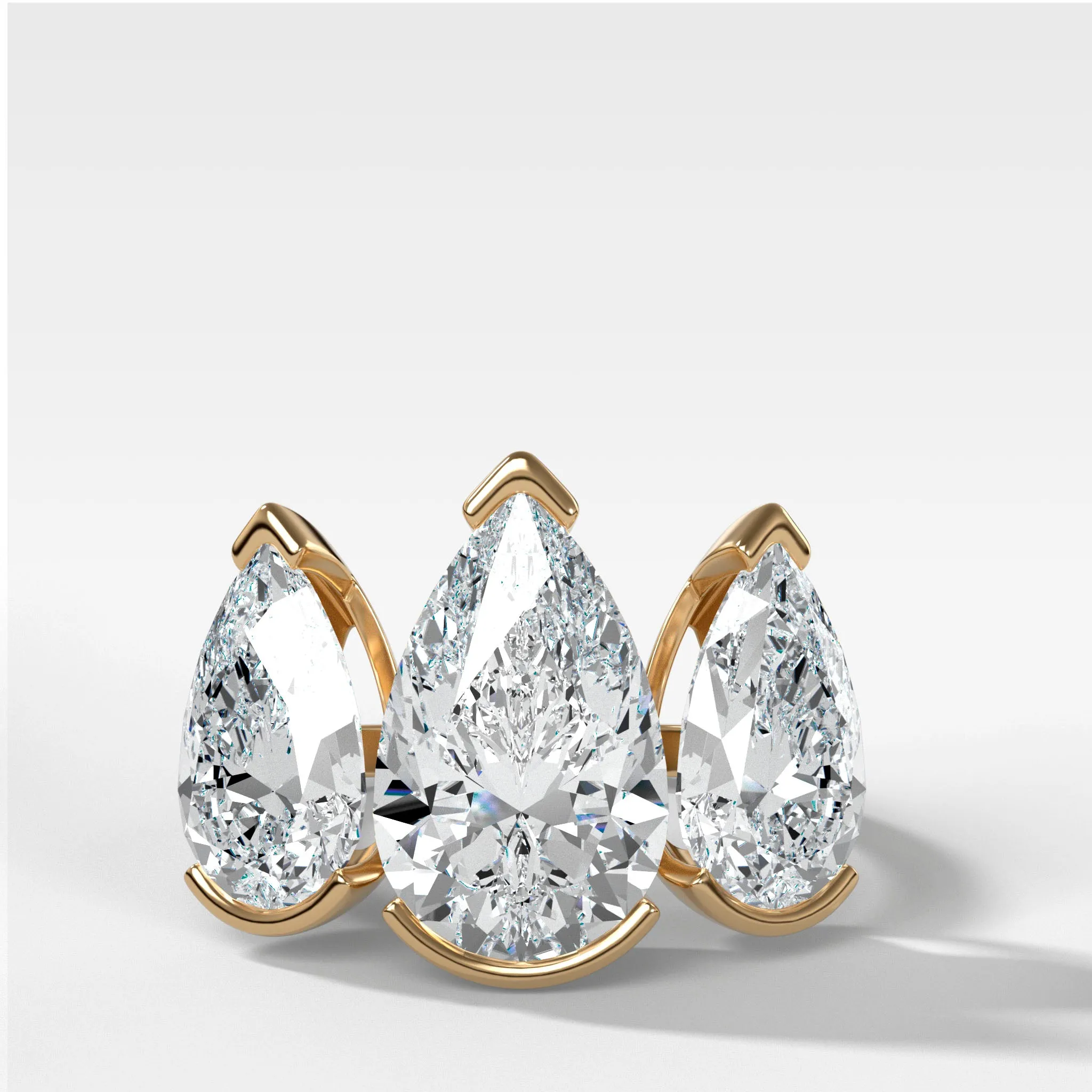 Half Bezel Triad Engagement Ring With Pear Cut Diamonds