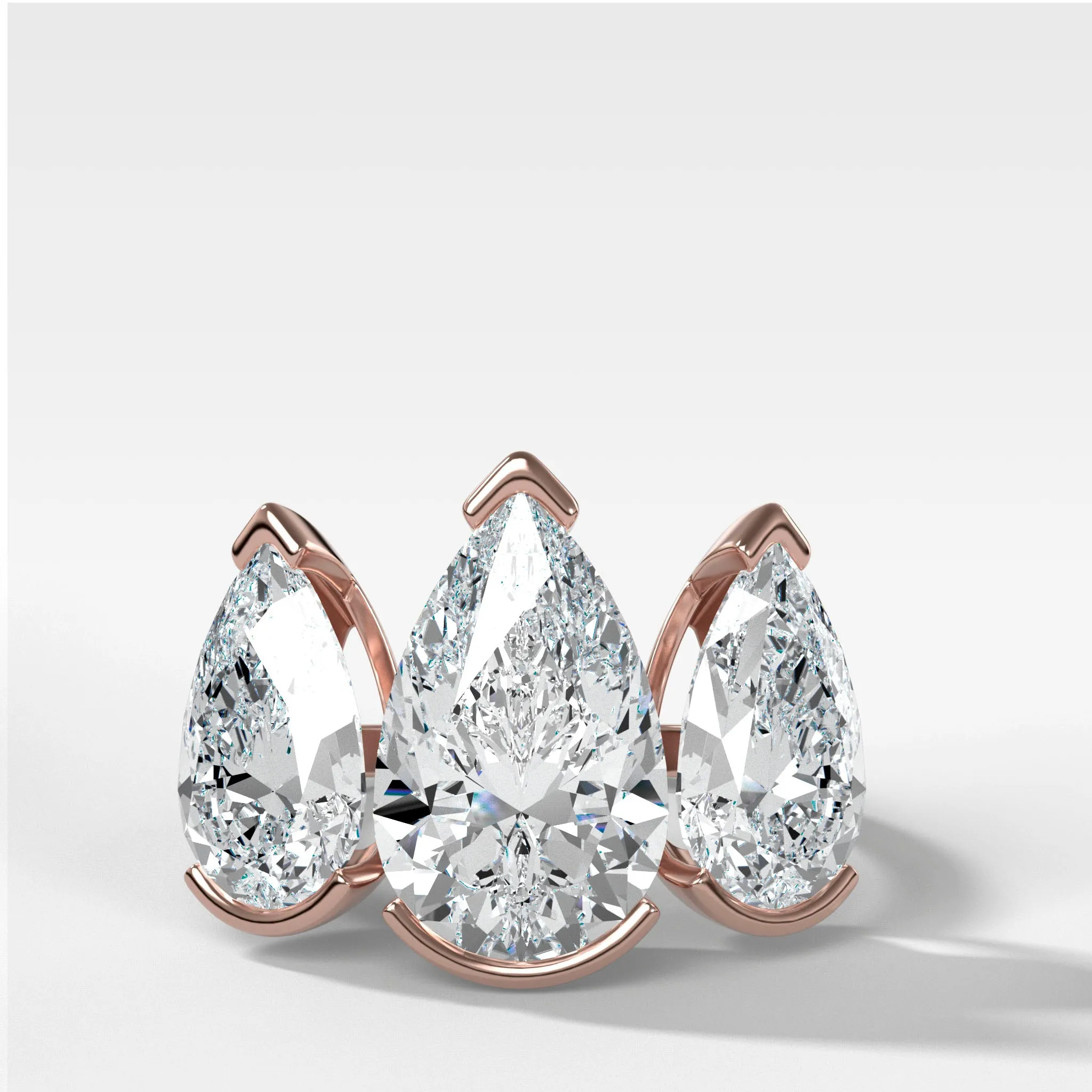 Half Bezel Triad Engagement Ring With Pear Cut Diamonds
