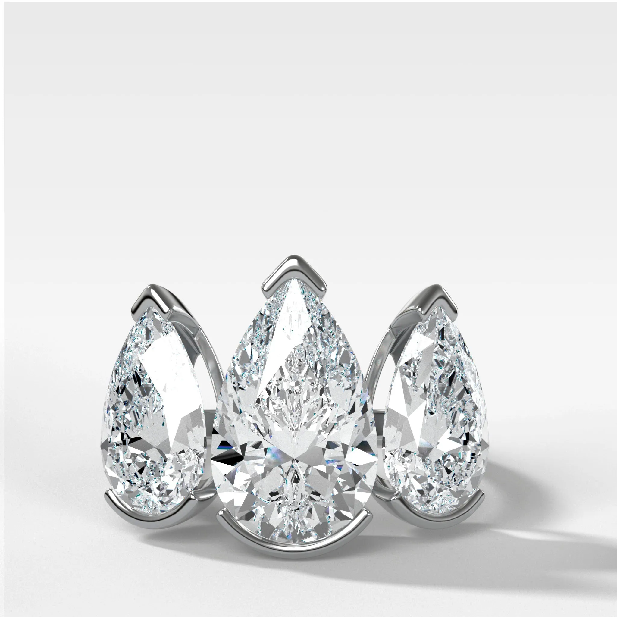 Half Bezel Triad Engagement Ring With Pear Cut Diamonds