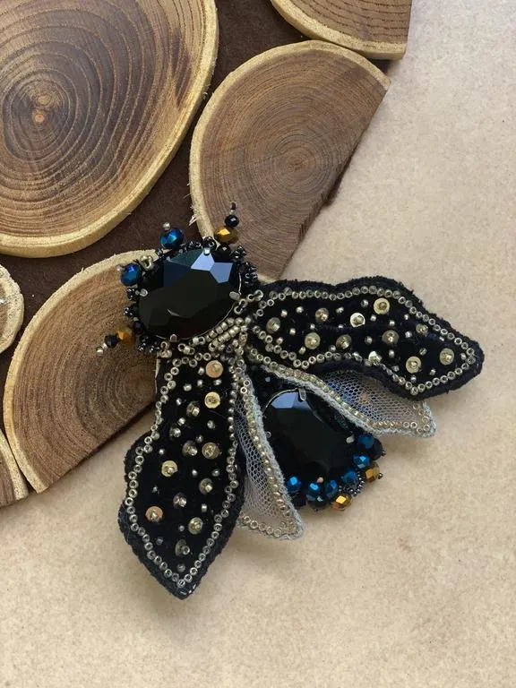 the escapist brooch